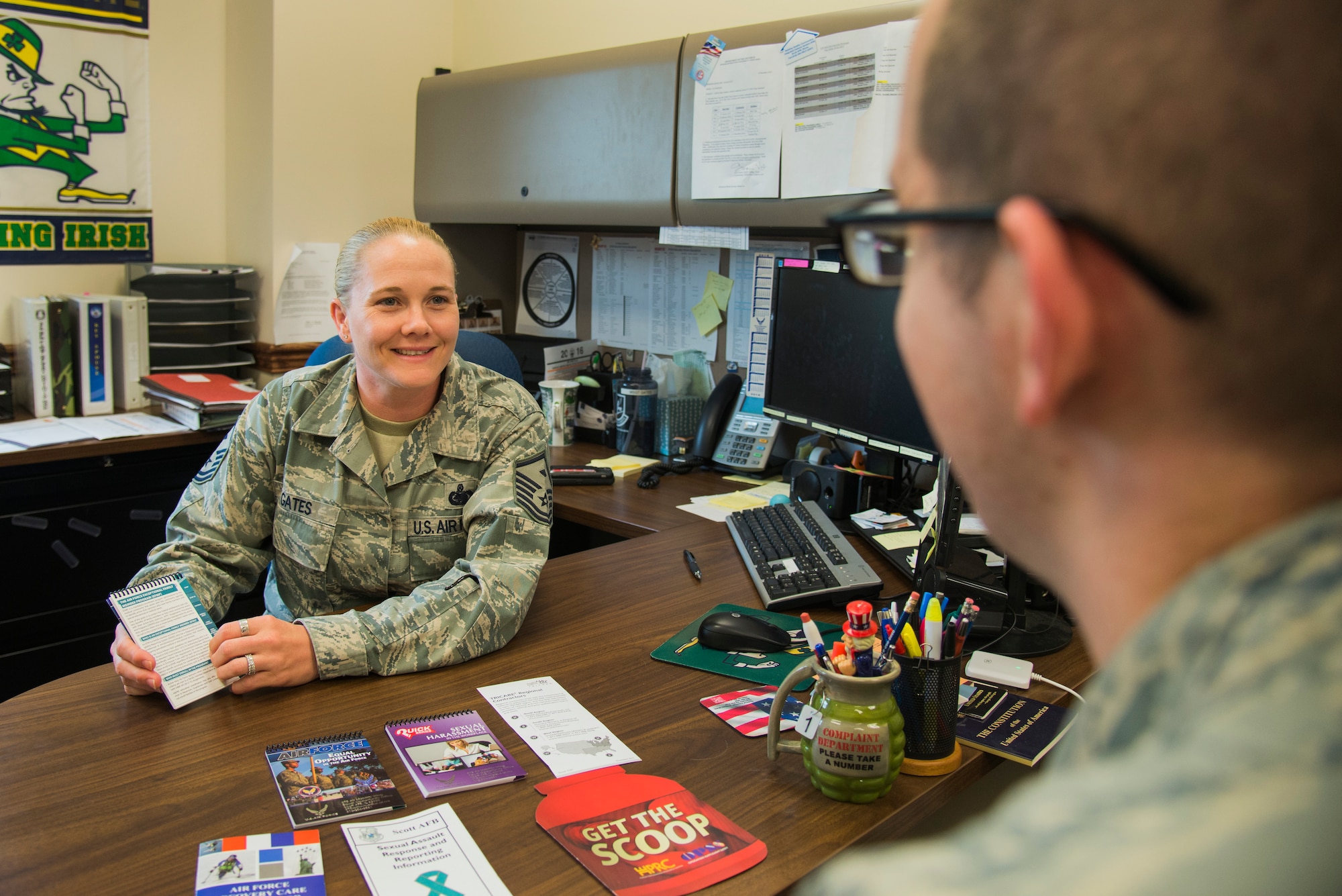 Master Sgt. Kristy Gates, 375th Security Forces Squadron first sergeant, goes over a list of resources with an Airman in her office April 27, 2016 at Scott Air Force Base Illinois. The duties of a first sergeant include advising the commander on a range of topics including the health, discipline, mentoring, well-being, career progression and professional development of all enlisted members. (U. S. Air Force Photo by Airman Daniel Garcia/Released)