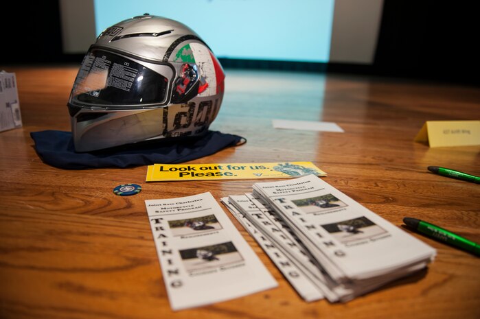 A helmet, which was given away, is displayed in front of safety pamphlets during the annual Motorcycle Safety Day, April 29, 2016, at Joint Base Charleston, S.C. The annual briefing is required by AFI 91-207, for all active duty Air Force motorcyclists. (U.S. Air Force photo/Staff Sgt. Jared Trimarchi) 