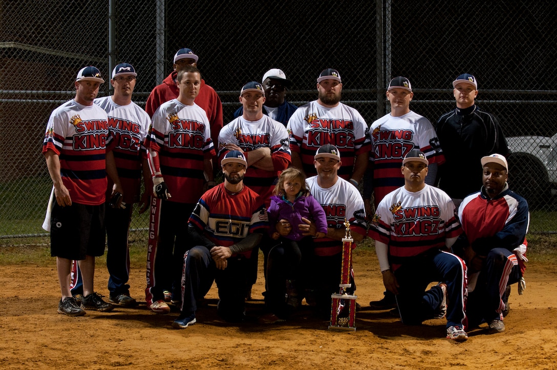 Winners of the 2nd Annual Kings of the Bay Softball Tournament, the Swing Kingz, pose with the first place trophy at Langley Air Force Base, Va., April 30, 2016. The Swing Kingz, a local Virginia military travel team, defeated the 757 Destroyers, a Hampton Roads Navy Team, 14-12 to win first place. (U.S. Air Force photo by Airman 1st Class Kaylee Dubois).