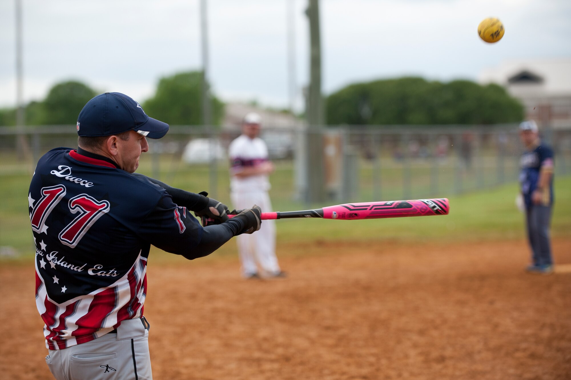 A member of the 45th Intelligence Squadron Dream Crushers team hits a softball during the 2nd Annual Kings of the Bay Softball Tournament at Langley Air Force Base, Va., April 30, 2016. The tournament raised over $1,900 for the 30th Intelligence Squadron booster club. (U.S. Air Force photo by Airman 1st Class Kaylee Dubois)