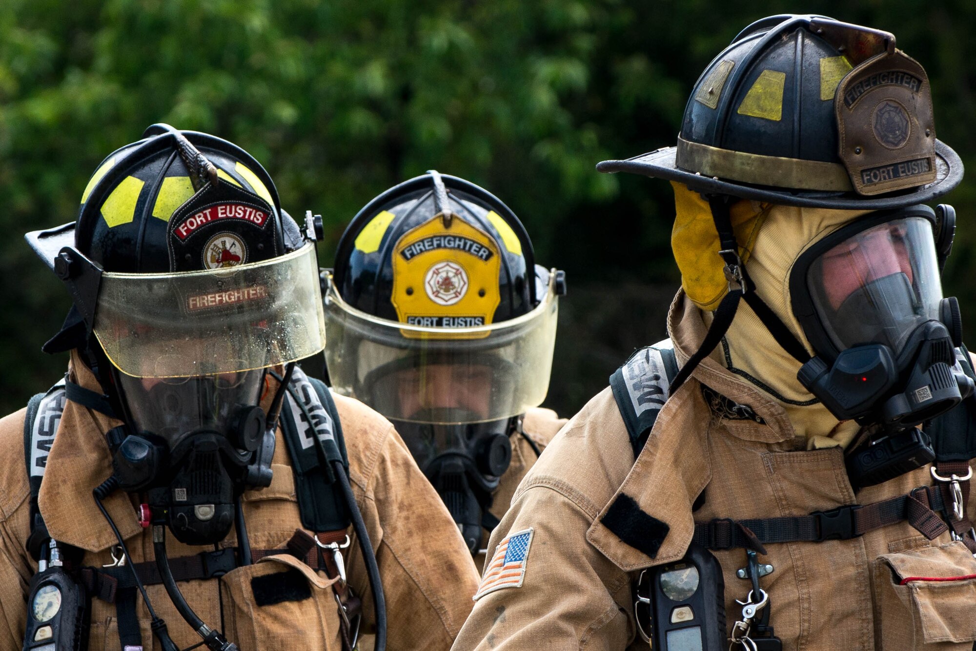Fort Eustis fire department fire fighters walk back to their truck after completing an aircraft live fire exercise at Fort Eustis, Va., April 27, 2016. The fire fighters also practiced victim rescue approaches and fire extinguishment. (U.S. Air Force photo by Staff Sgt. J.D. Strong II)