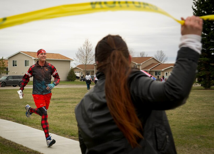 The 5th Medical Group and Health and Wellness Center hosted its third annual 5k/10k Meltdown Color Fun Run on Minot Air Force Base, N.D., April 27, 2016. Approximately 175 runners participated in the event which was held to raise awareness for sexual assault, alcohol awareness and child abuse prevention. Color run T-shirt sales raised over $300 which will be used to support the Sexual Assault Prevention and Response program, Alcohol and Drug Abuse Prevention and Treatment program and the Family Advocacy Program. (U.S. Air Force photo/Senior Airman Sahara Fales)