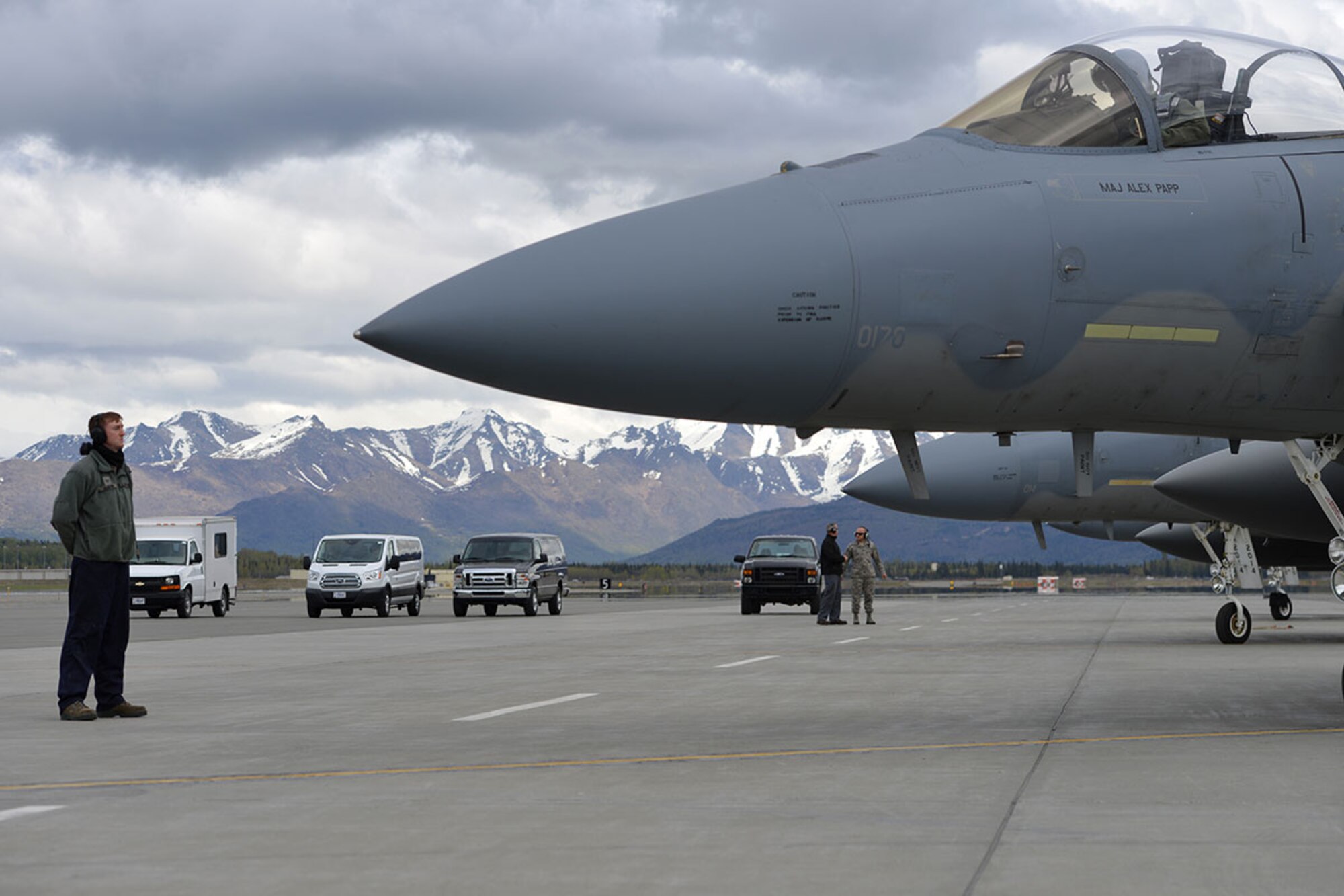 Air Force Staff Sgt. Austin Hamilton, an F-15 crew chief with the 96th Aircraft Maintenance Squadron, Eglin Air Force Base, Fla., stands at parade rest while his pilot prepares to taxi on Joint Base Elmendorf-Richardson’s flightline, May 3, 2016. Hamilton is deployed to JBER as part of Red Flag-Alaska, a Pacific Air Forces commander-directed field training exercises for U.S. and international forces, providing combined offensive counter-air, interdiction, close air support and large force employment training in a simulated combat environment. (U.S. Air Force photo by Airman 1st Class Javier Alvarez)