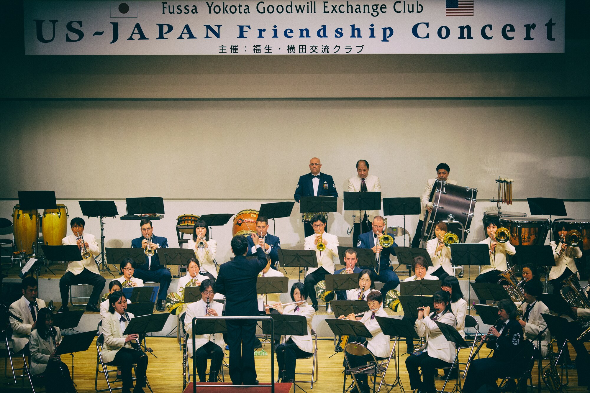 Members from the Fussa Wind Ensemble and the Air Force Band of the Pacific-Asia perform during the 7th annual Fussa-Yokota Friendship Concert at Fussa City Hall, Tokyo, Japan, May 1, 2016. The Fussa-Yokota Goodwill Exchange Club hosted the event to strengthen the relationship between the U.S. and Japan through music. (U.S. Air Force photo by Yasuo Osakabe/Released)  
