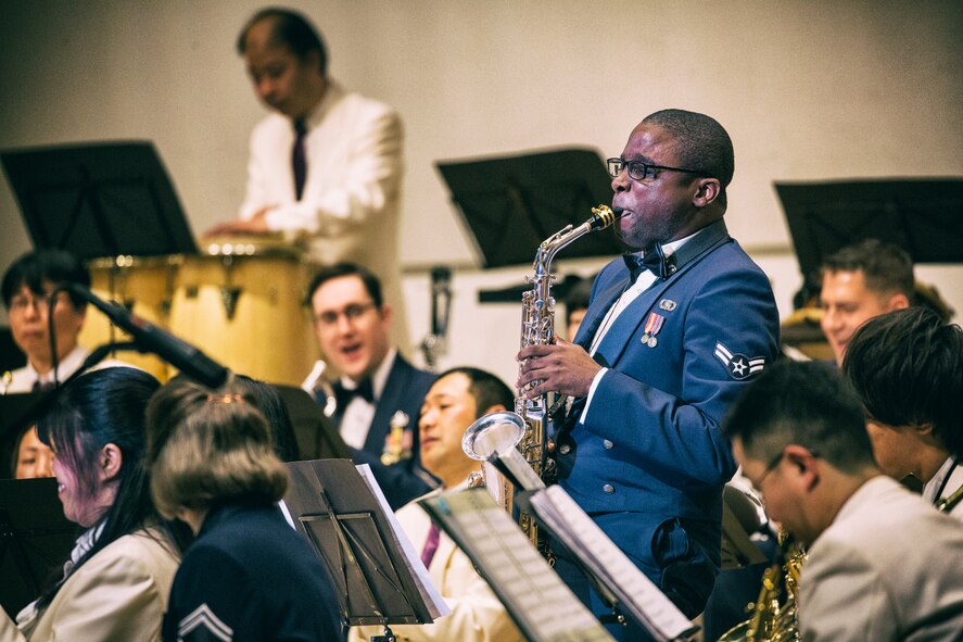 Airman 1st Class Derrick Newbold, the Air Force Band of the Pacific-Asia, plays a saxophone during the 7th annual Fussa-Yokota Friendship Concert at Fussa City Hall, Tokyo, Japan, May 1, 2016. The Fussa-Yokota Goodwill Exchange Club hosted the event to strengthen the relationship between the U.S. and Japan through music. (U.S. Air Force photo by Yasuo Osakabe/Released)  