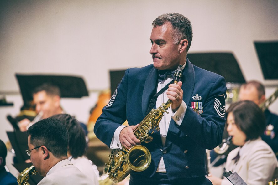 Master Sgt. James Butler, the Air Force Band of the Pacific-Asia, prepares to play a saxophone during the 7th Annual Fussa-Yokota Friendship Concert at Fussa City Hall, Tokyo, Japan, May 1, 2016. The Fussa-Yokota Goodwill Exchange Club hosted the event to strengthen the relationship between the U.S. and Japan through music. (U.S. Air Force photo by Yasuo Osakabe/Released)  