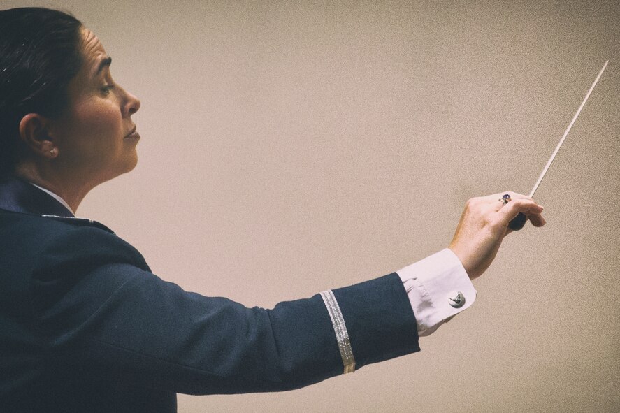 Lt. Col. Cristina Moore Urrutia, the Air Force Band of the Pacific-Asia, conducts the Fuusa Wind Ensemble and PACAF Band during the 7th Annual Fussa-Yokota Friendship Concert at Fussa City Hall, Tokyo, Japan, May 1, 2016. The Fussa Wind Ensemble has performed for over 20 years and is based in Fussa City. (U.S. Air Force photo by Yasuo Osakabe/Released)