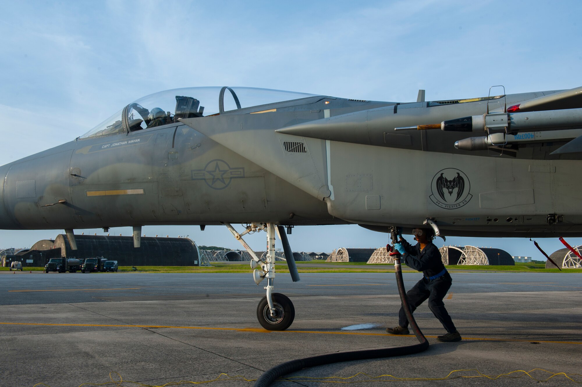 U.S. Air Force Airman 1st Class Daniel Kelly, 44th Aircraft Maintenance Unit crew chief, sets up the hose from an R-11 refueling truck to an F-15C Eagle during a training surge May 4, 2016, at Kadena Air Base, Japan. Surges increase the number of training flights each day during a set time period, ensuring combat readiness, and are made possible by hot pits refueling. (U.S. Air Force photo by Airman Zackary A. Henry)