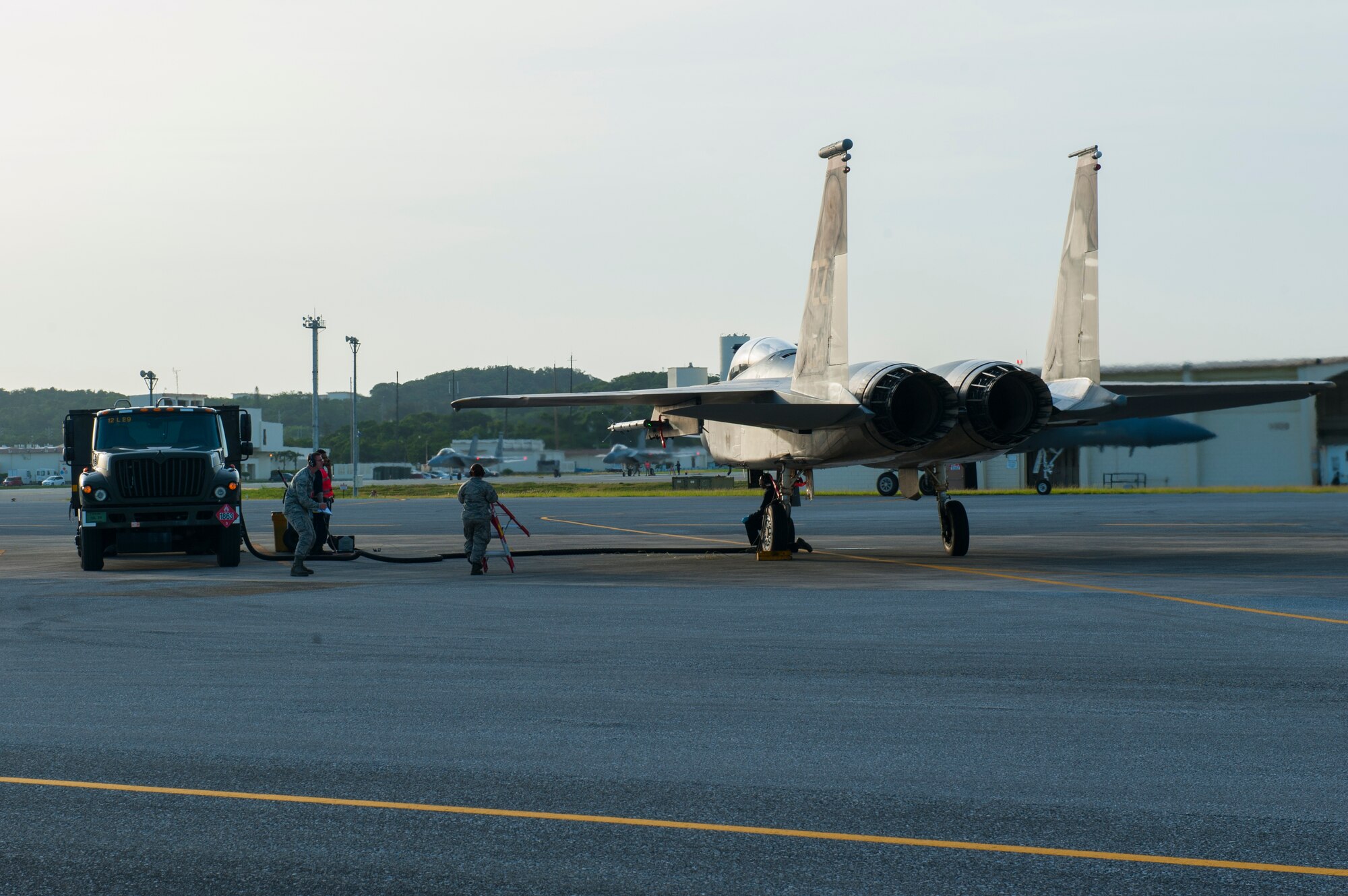Airmen from the 18th Wing refuel an F-15C Eagle May 4, 2016, at Kadena Air Base, Japan. Multiple Airmen from different flights worked together during this training surge to achieve the maximum possible flying hours, ensuring combat readiness. (U.S. Air Force photo by Airman Zackary A. Henry)