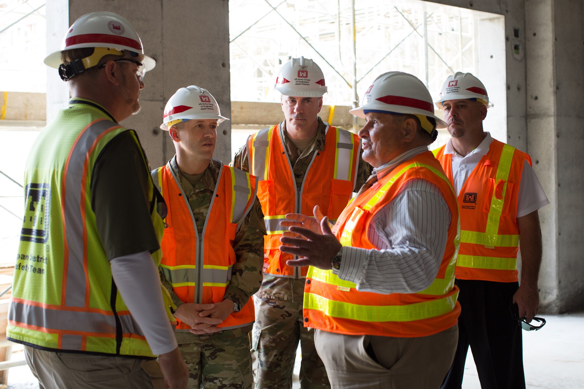 Michael Thompson, Okinawa superintendent, Department of Defense Education Activity Pacific, discusses the finer points of the 21st century school concept with Brig. Gen. Jeffrey Milhorn, commander, Pacific Ocean Division, U.S. Army Corps of Engineers and Col. John Hurley, commander, Japan Engineer District, U.S. Army Corps of Engineers, as they tour the construction site of the new Kadena Elementary School April 7, 2016, at Kadena Air Base, Japan. Leaders from the U.S. Army Corps of Engineers were briefed on construction of the new facility, as well as participating in a Science, Technology, Engineering and Math learning opportunity for five elementary school students who joined on the tour. (Courtesy photo)