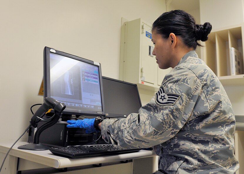 U.S. Air Force Staff Sgt. Mariecrist Shuty, 18th Medical Support Squadron radiology technologist, examines an X-ray, April 29, 2016, at Kadena Air Base, Japan. The 18th Medical Support Squadron operates across the Kadena squadrons, enhancing the health and wellness of Kadena’s warfighters and their family members through services that include information systems, laboratory, logistics, medical readiness, nutritional medicine, pharmacy, resource management, and patient administration. (U.S. Air Force photo by Naoto Anazawa)