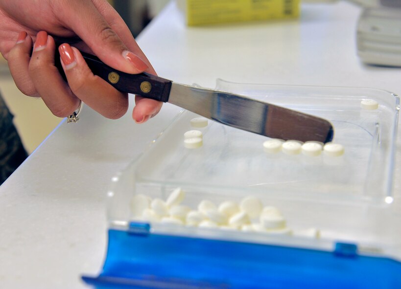 U.S. Air Force Senior Airman Kimberly Walker, 18th Medical Support Squadron pharmacy technician, fills a prescription, May 4, 2016, at Kadena Air Base, Japan. The pharmacy section keeps track of all of the pharmaceutical supplies to ensure that they are stocked for their patients’ needs. (U.S. Air Force photo by Naoto Anazawa)
