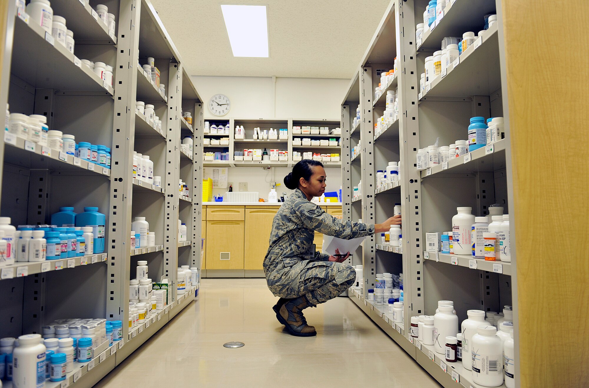 U.S. Air Force Senior Airman Kimberly Walker, 18th Medical Support Squadron pharmacy technician, stocks medicines, May 4, 2016, at Kadena Air Base, Japan. The shelves are stocked and inventoried to keep the pharmacy supplied for all of Kadena’s patients’ needs. (U.S. Air Force photo by Naoto Anazawa)

