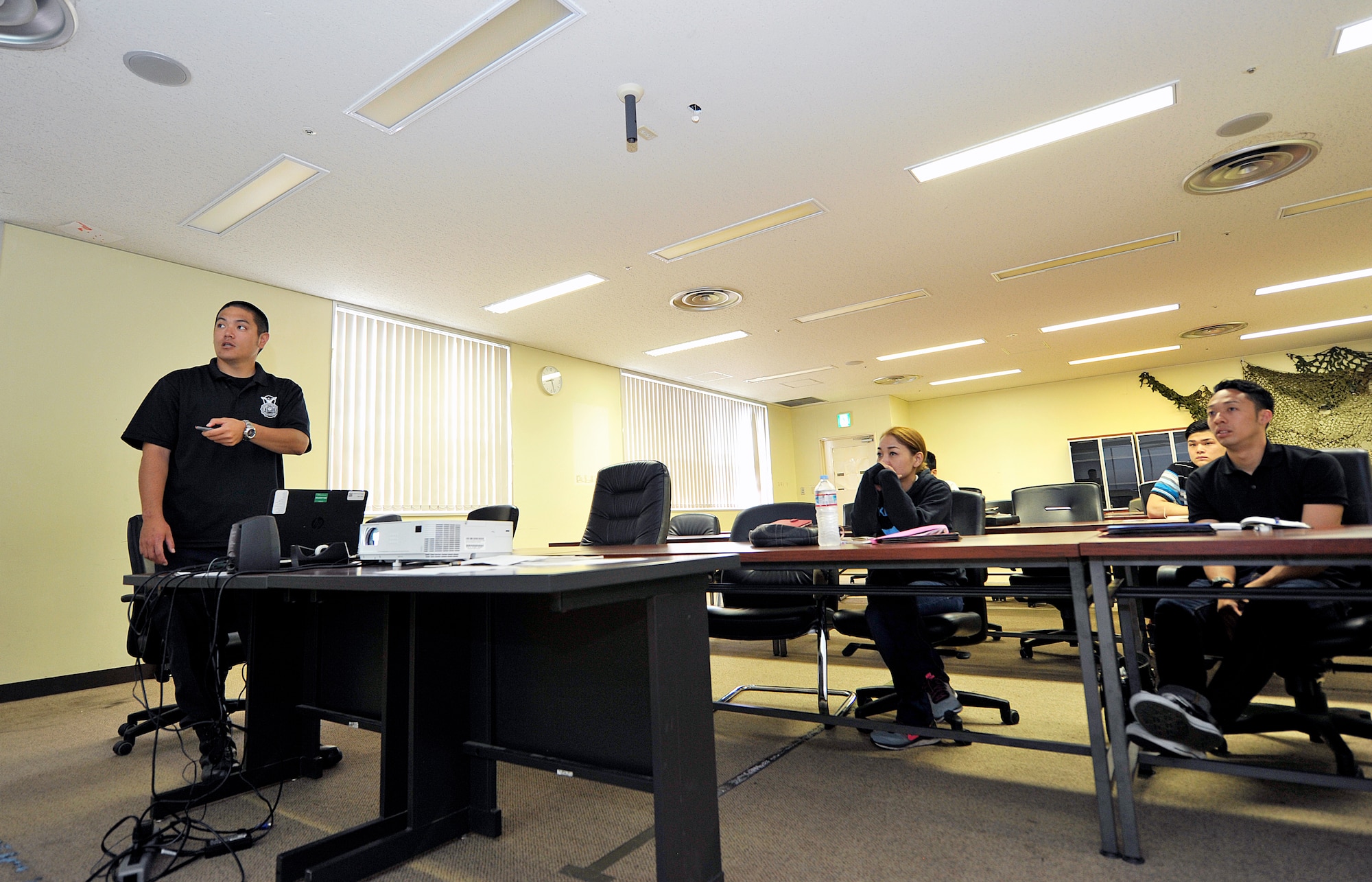 Yoshikazu Isa, 18th Security Forces Squadron master labor contractor training instructor, conducts training for new guards, May 3, 2016, at Kadena Air Base, Japan. Isa's goal at the 18th SFS is to honorably bring up these new guards. (U.S. Air Force photo by Naoto Anazawa)

