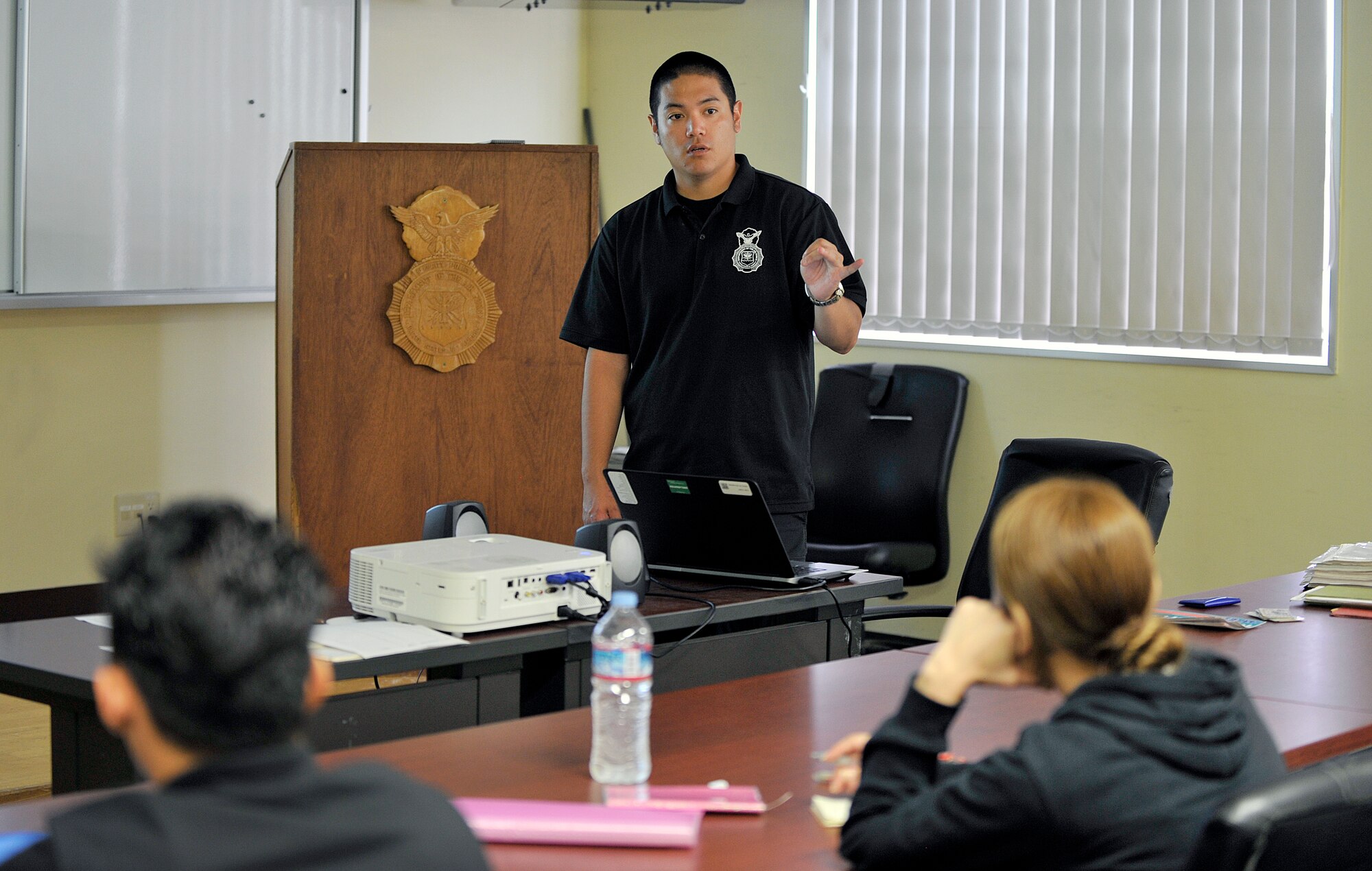 Yoshikazu Isa, 18th Security Forces Squadron master labor contractor training instructor, conducts training for new guards, May 3, 2016, at Kadena Air Base, Japan. Isa had yearned to be a police officer since he was a student and now has been able to fulfill that goal over the last three years. (U.S. Air Force photo by Naoto Anazawa)