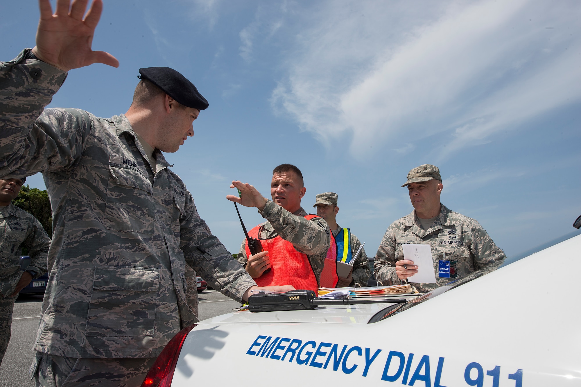 U.S. Air Force emergency responders discuss procedures during an active shooter exercise May 4, 2016, at Kadena Air Base, Japan. The exercise was devised by the Wing Inspection Team to test the capabilities of Kadena’s 18th Security Forces Squadron, fire fighters and scenario participants. (U.S. Air Force photo by Staff Sgt. Maeson L. Elleman)
