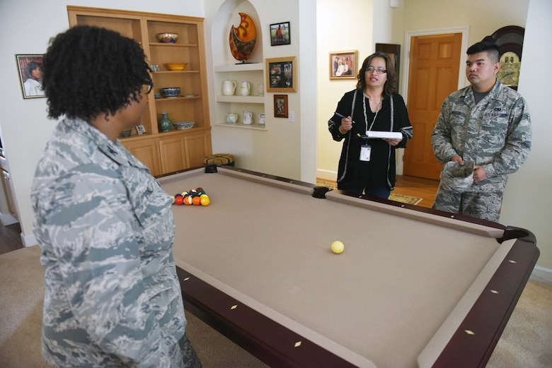 Maria Benavente, 30th Logistics Readiness Squadron quality assurance, and Airman 1st Class John Matthew Manere, 30th  LRS personal property counselor, brief Col. Melanie Prince, 30th Medical Group commander, on upcoming move, April 29, 2016, Vandenberg Air Force Base, Calif. The traffic management office provides a variety of tips to ensure military permanent change of duty station movement is executed with care and precision. (U.S. Air Force photo by Staff Sgt. Jim Araos/Released)