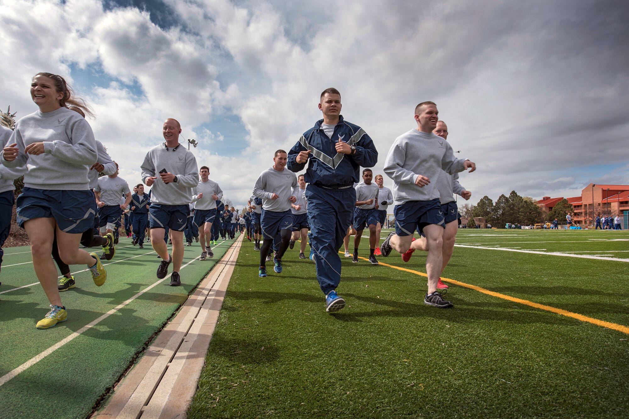 PETERSON AIR FORCE BASE, Colo. – Team Pete personnel start a 5K run around the track on the Peterson football field during the 21st Space Wing Warfit April 19, 2016. The run is not only to encourage fitness but also to promote the Sexual Assault Prevention and Response Program (SAPR).  Personnel from the SAPR program and volunteers handed out T-Shirts with the slogan “Eliminate Sexual Assault: Know Your Part. Do Your Part. (U.S. Air Force Photo by Craig Denton)