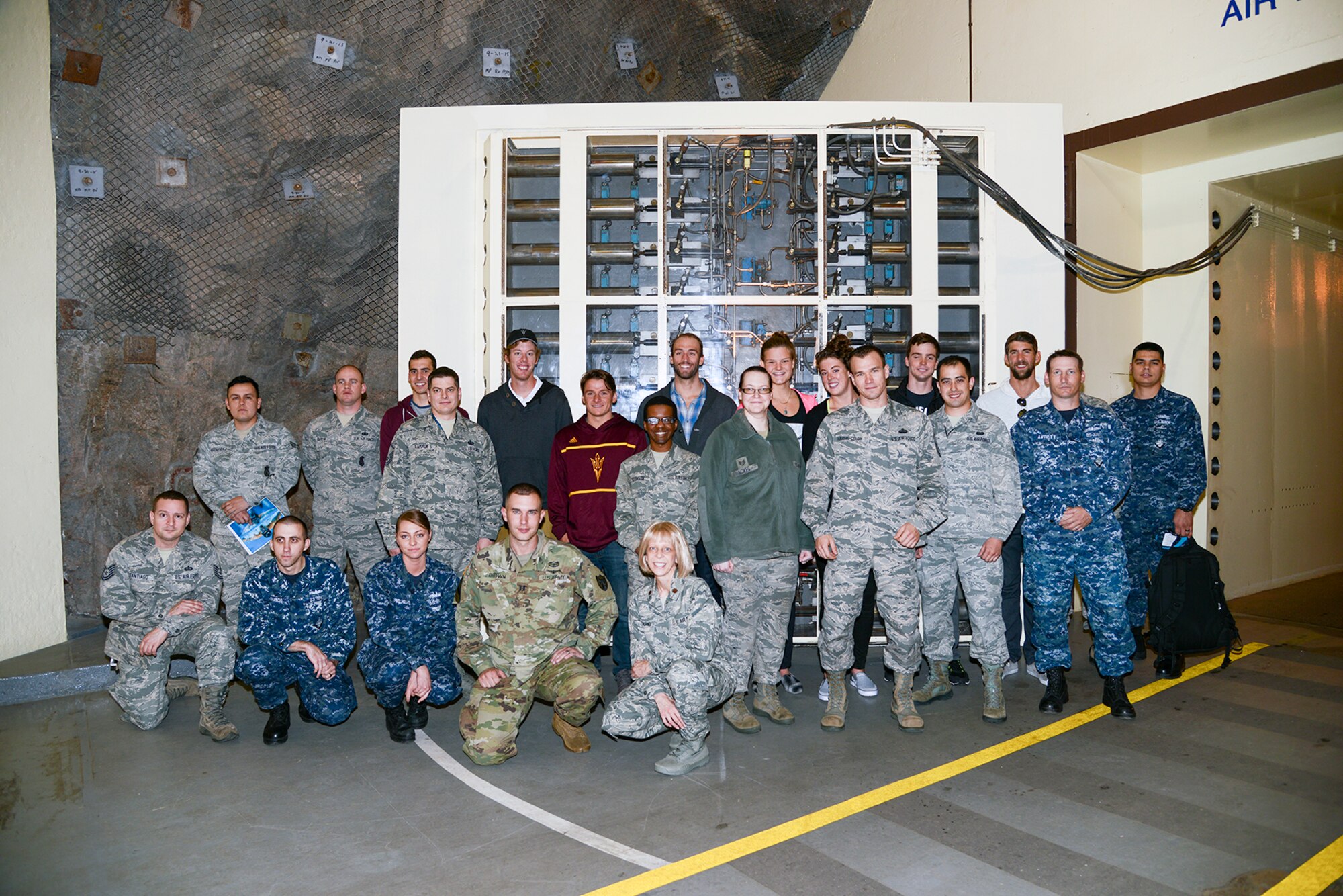 CHEYENNE MOUNTAIN AIR FORCE STATION, Colo. – Olympic Gold Medalists Michael Phelps and Allison Schmitt, along with members of the U.S. National Swimming Team, visited Cheyenne Mountain Air Force Station May 2, 2016. The swimmers toured the Mountain, signed autographs and posed for pictures with the service members “Behind the Blast Doors”. The visit was part of the ongoing 50th Anniversary celebration for the Mountain. (U.S. Air Force photo by Master Sgt. Jared Marquis)
