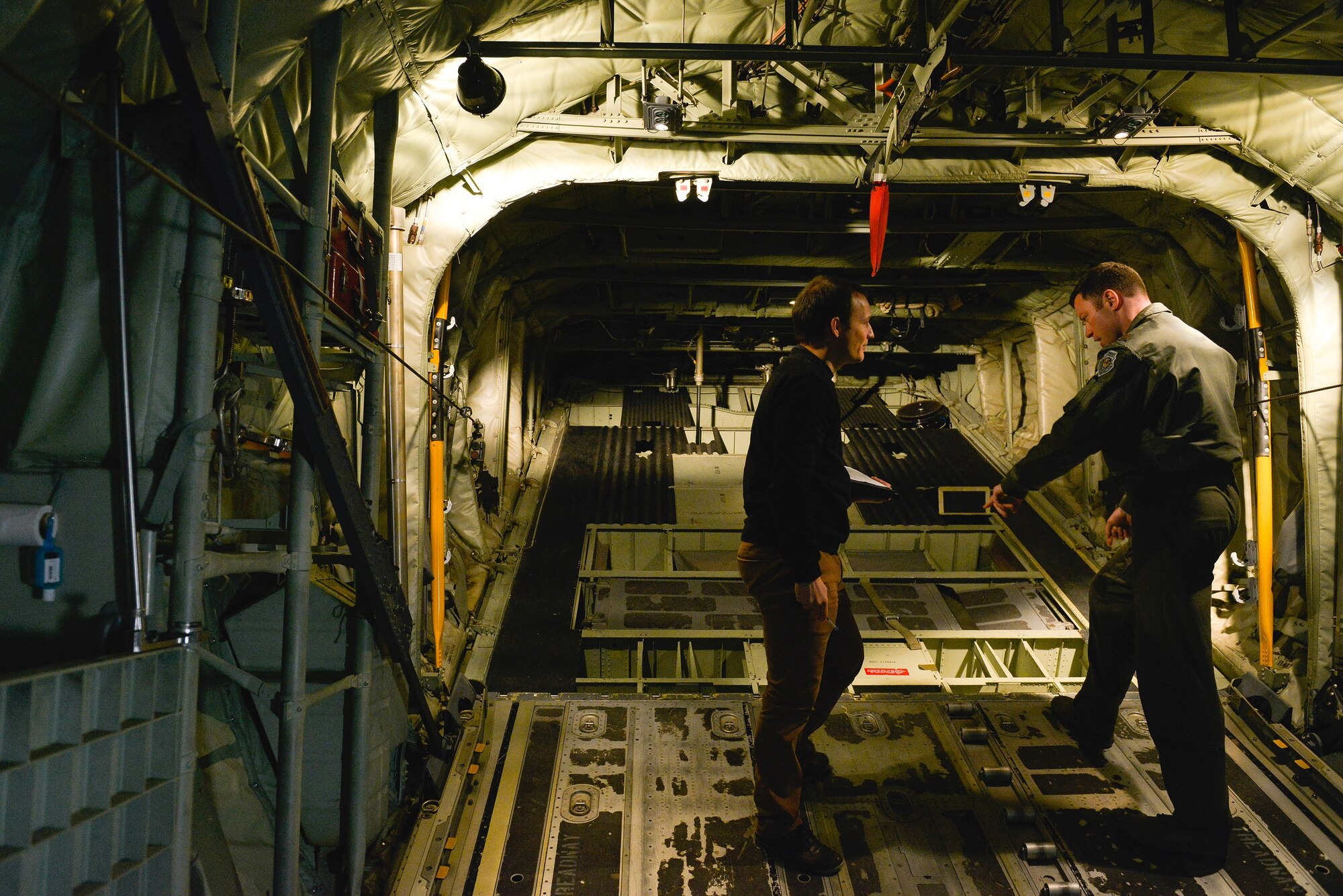 Tech. Sgt. James Moenning, 37th Airlift Squadron evaluator loadmaster, discusses the operations of a C-130J Super Hercules ramp with Pierre Yves, a French military contractor April 28, 2016, at Ramstein Air Base, Germany. The French air force recently purchased several C-130s and visited the 37th Airlift Squadron to survey the aircraft in order to better understand its features and capabilities. U.S. Air Force Photo/ Airman 1st Class Lane Plummer)