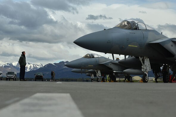 U.S. Air Force Staff Sgt. Austin Hamilton, an  F-15 Eagle crew chief with the 96th Aircraft Maintenance Squadron, Eglin Air Force Base, Fla., waits as his pilot prepares to taxi on the Joint Base Elmendorf-Richardson, Alaska flightline May 3, 2016 during RED FLAG-Alaska (RF-A) 16-1. RF-A is a Pacific Air Forces commander-directed field training exercise for U.S. and international forces, which provides joint offensive counter-air, interdiction, close air support, and large-force employment training in a simulated combat environment. (U.S. Air Force photo by Airman 1st Class Kyle Johnson)