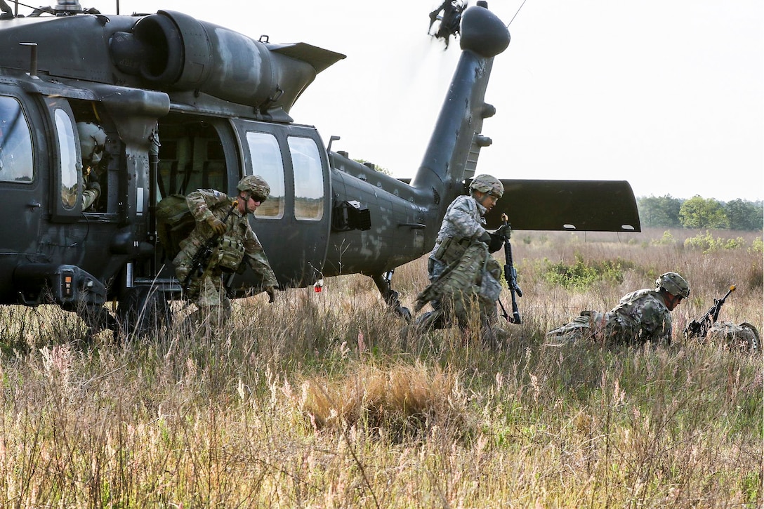 Paratroopers exit a UH-60 Black Hawk helicopter during an air assault mission as part of a training exercise to repair damaged airfields at Fort Bragg, N.C., April 27, 2016. Army photo by Sgt. Juan F. Jimenez