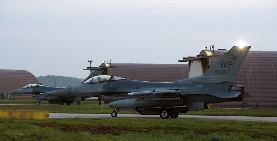 F-16 Fighting Falcons from the 35th Fighter Squadron perform preflight checks during Beverly Midnight 16-3 at Kunsan Air Base, Republic of Korea, May 4, 2016. The exercise accentuated the importance of maintaining heightened readiness and aircraft alert levels to ensure security on the Korean peninsula. (U.S. Air Force photo by Staff Sgt. Nick Wilson/Released) 