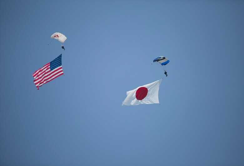 Pemberton Aerosports executed a flag jump during the Marine Corps Air Station Iwakuni Friendship Day 2016 Air Show, Japan, May 5, 2016. Since 1973, MCAS Iwakuni has conducted a single-day air show and open house specifically designed to foster positive relationships between the air station and our Japanese hosts, and the event traditionally draws more than 200,000 visitors and participants. This year is the 40th Friendship Day, offering a culturally enriching experience that displays the mutual support that the U.S. and Japan share. This annual event showcases a variety of static displays, aviation performances and demonstrations, and provides food and entertainment for guests of the largest single-day event in Iwakuni.  (U.S. Marine Corps photo by Cpl. Douglas Simons/Released)