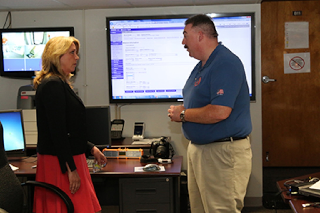 While visiting the Civil Air Patrol National Operations Center, Secretary of the Air Force Deborah Lee James was briefed by John Desmarais, CAP’s director of operations. Since 2002, the NOC has coordinated mission approval for CAP operations in support of federal, state and local authorities across the U.S. The NOC coordinates approval for thousands of missions annually with 1st Air Force, 11th Air Force and PACAF.