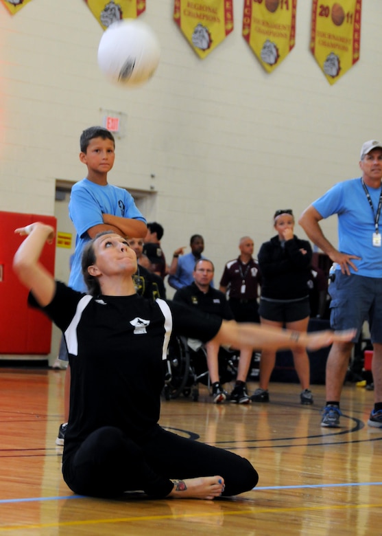 Medically retired Army Staff Sgt. Randi Gavell serves during the volleyball match for the gold medal against the Air Force during the 2015 DoD Warrior Games at Marine Corps Base Quantico, Va., June 28, 2015. The Army team earned the gold medal in a three-match win. DoD photo by Shannon Collins