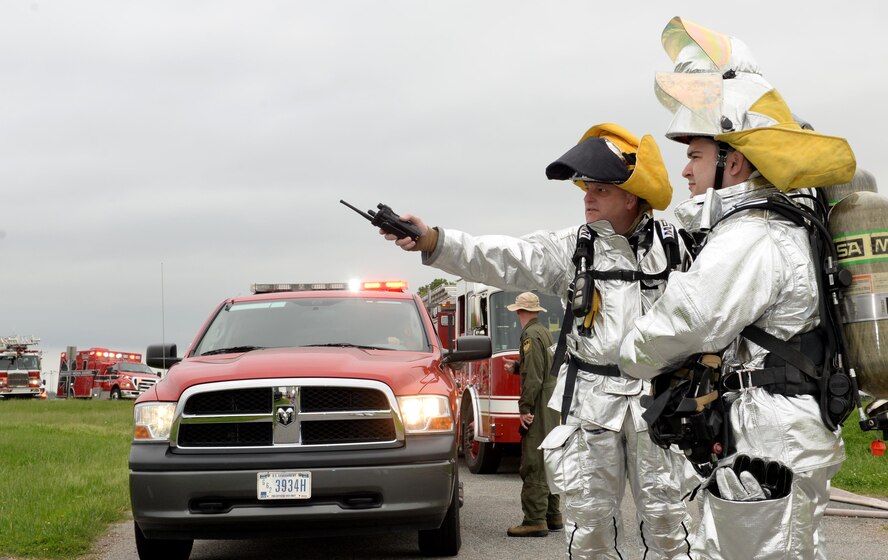 Adam Lynch, 2nd Civil Engineer Squadron fire chief, directs personnel during a simulated emergency at Barksdale Air Force Base, La., April 25, 2016. The installation’s emergency responders worked alongside partnering agencies from around the community, a critical relationship throughout a disaster, to ensure unified operations. (U.S. Air Force photo/Airman 1st Class Curt Beach)