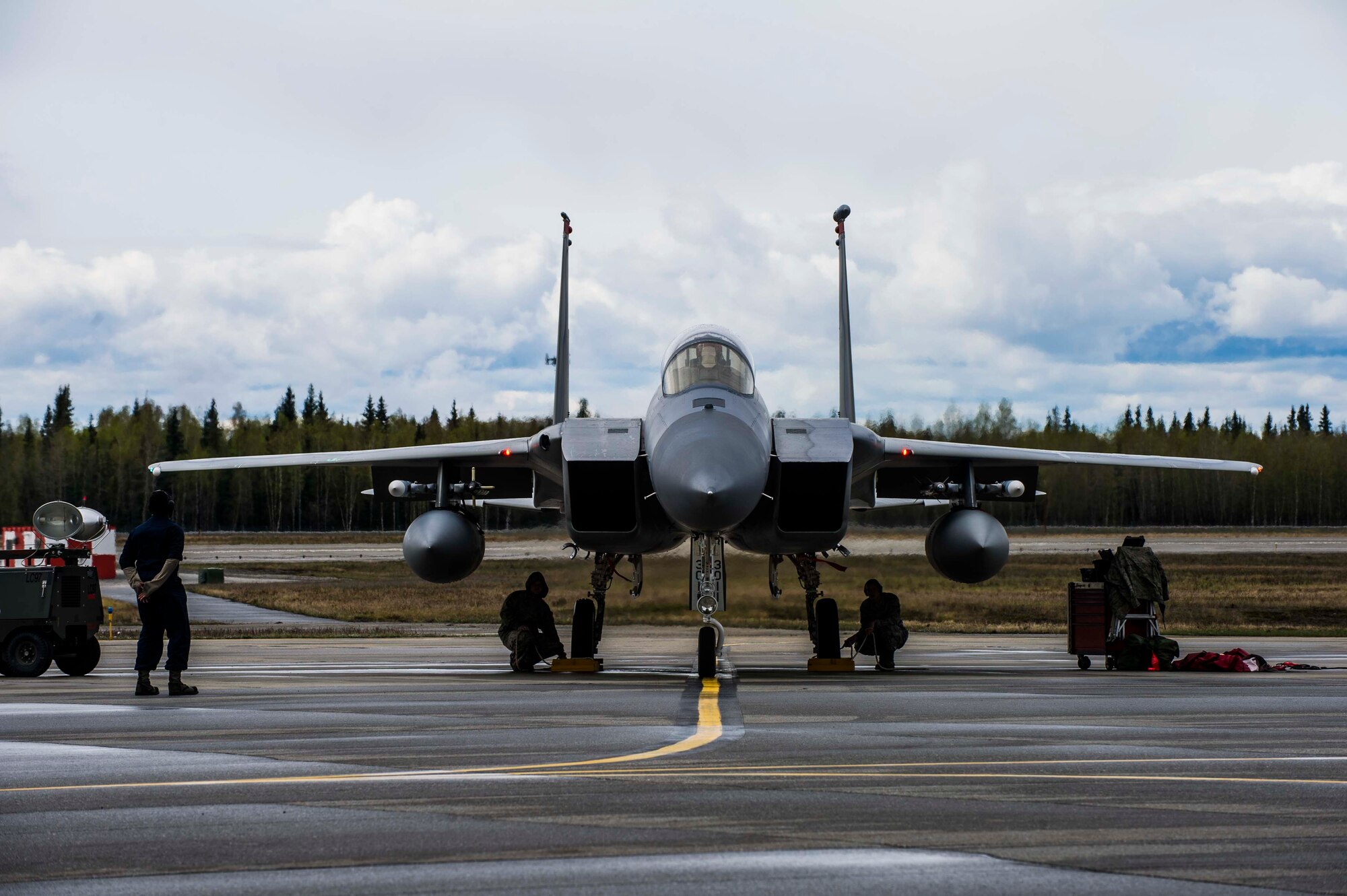 Members of the 67th Aircraft Maintenance Unit, Kadena Air Base, Japan prepare to launch an F-15 Eagle tactical fighter jet at Eielson Air Force Base, Alaska, May 3, 2016, during RED FLAG-Alaska (RF-A) 16-1. RF-A is a two-week long exercise that takes place within the Joint Pacific Alaska Range Complex which at 67,000 square miles is the largest instrumented air, ground and electronic combat training range in the world. (U.S. Air Force photo by Staff Sgt. Joshua Turner/Released)