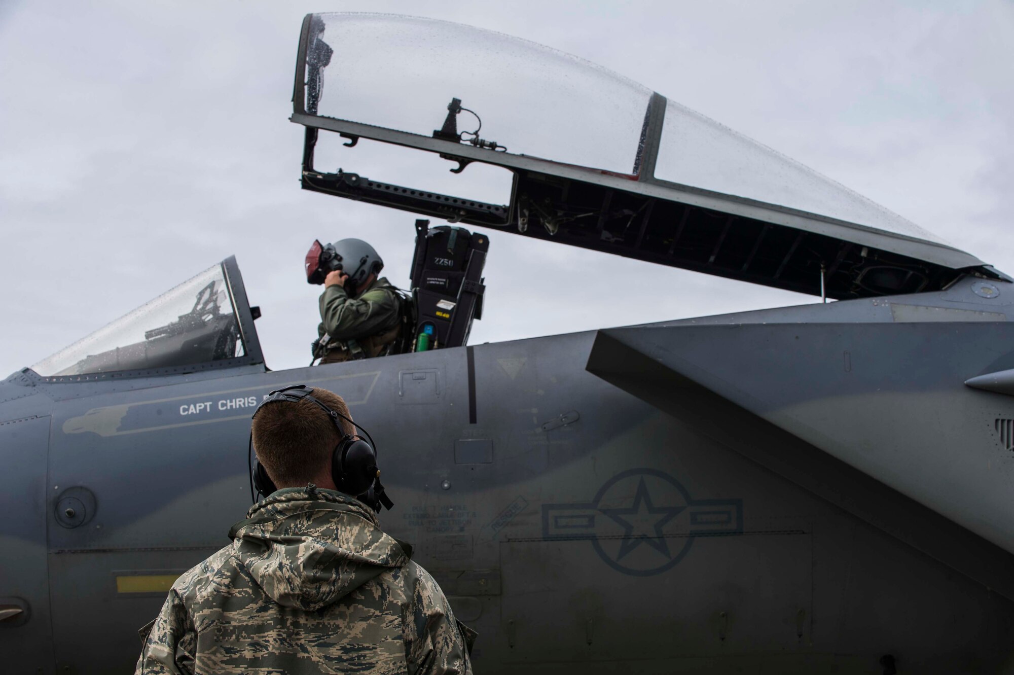U.S. Air Force Senior Airman Dyllan Jones, a crew chief assigned to the 67th Aircraft Maintenance Unit, Kadena Air Base, Japan, waits for the pilot of an F-15 Eagle tactical fighter jet to prepare for a launch at Eielson Air Force Base, Alaska, May 3, 2016, during RED FLAG-Alaska (RF-A) 16-1. RF-A is a two-week long exercise that takes place within the Joint Pacific Alaska Range Complex which at 67,000 square miles is the largest instrumented air, ground and electronic combat training range in the world. (U.S. Air Force photo by Staff Sgt. Joshua Turner/Released)