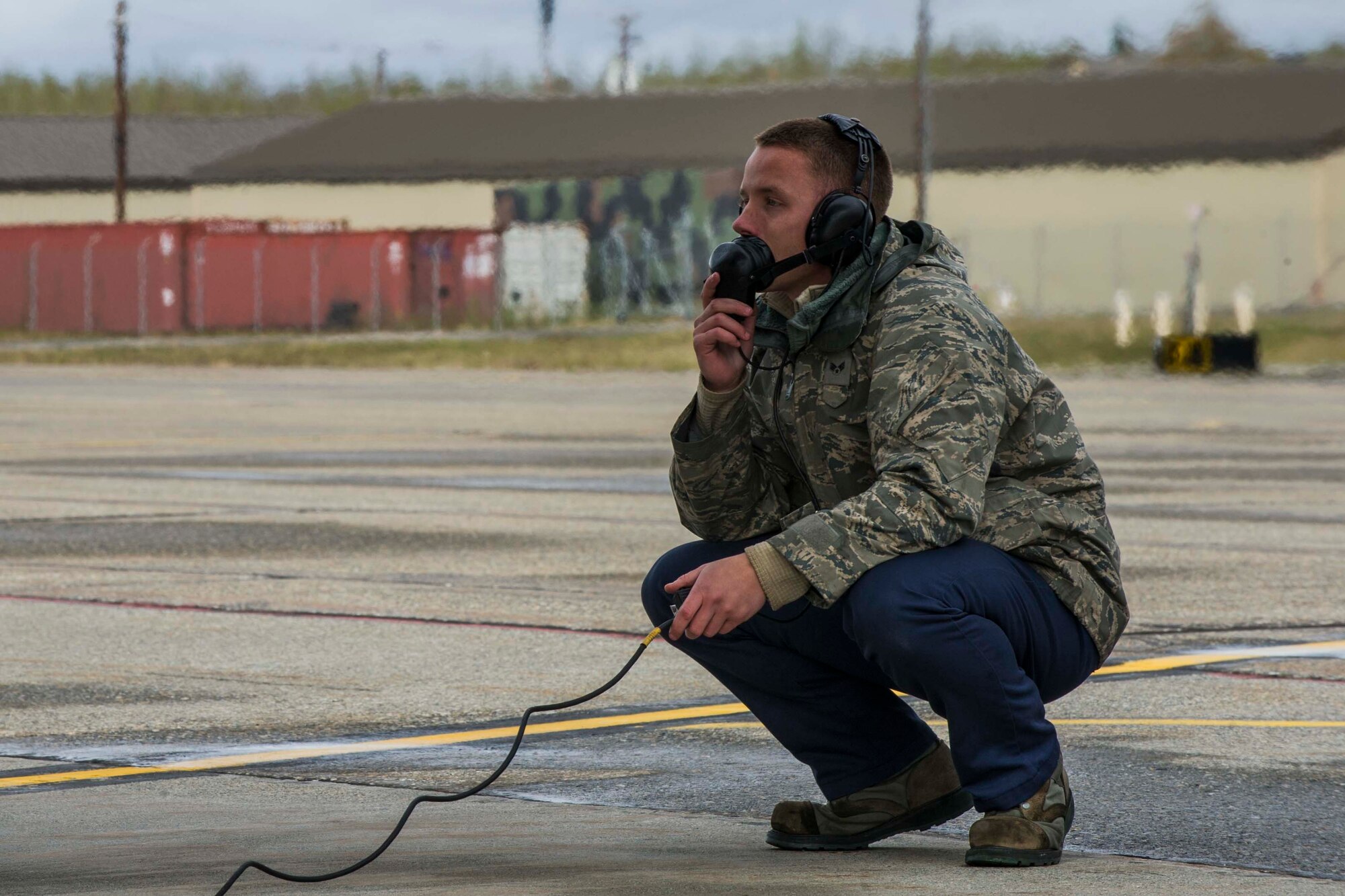 U.S. Air Force Senior Airman Dyllan Jones, a crew chief assigned to the 67th Aircraft Maintenance Unit, Kadena Air Base, Japan, speaks to the pilot of an F-15 Eagle tactical fighter jet at Eielson Air Force Base, Alaska, May 3, 2016, during RED FLAG-Alaska (RF-A) 16-1. Jones checks the movements of various moving parts while the pilot runs though pre-flight checks in the cockpit. (U.S. Air Force photo by Staff Sgt. Joshua Turner/Released)