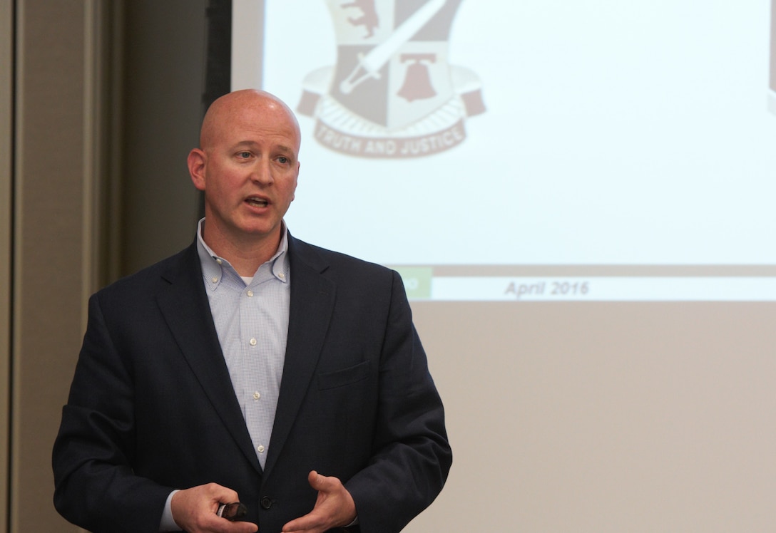 Lt. Col. John Dunn, Commander of the 159th Military Police Battalion (Criminal Investigation Division), describes the 200th MP Command's Guardian Shield Exercise to civilian and military law enforcement leadership during an International Association of Chiefs of Police meeting at Hanscom Air Force Base, Massachusetts, April 16. Guardian Shield provides slots for federal, state or local law enforcement departments to send their personnel, and includes FBI-approved hostage negotiation training and classes derived from the Federal Law Enforcement Training Center.