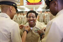 Richmond, Va.-native Mercedes N. Hargrove pins on the rank of Master Chief Petty Officer during a promotion ceremony at Naval Support Facility Indian Head, Md., May 4, 2016. Hargrove serves as the Navy Senior Enlisted Leader with Chemical Biological Incident Response Force. (Official USMC Photo by Sgt. Jonathan Herrera/Released)