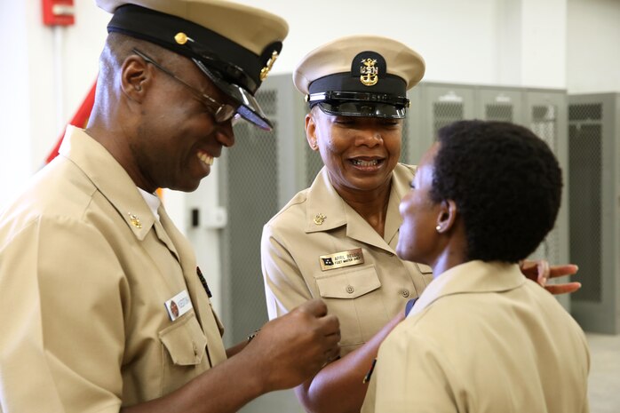 Master Chief Petty Officer April D. Beldo, fleet master chief of Manpower, Personnel, Training and Education (center), and Master Chief Petty Officer Henry Kuedituka (left) pin on the rank of Master Chief Petty Officer to Richmond, Va.-native Mercedes N. Hargrove during a promotion ceremony at Naval Support Facility Indian Head, Md., May 4, 2016. Hargrove serves as the Navy Senior Enlisted Leader with Chemical Biological Incident Response Force. (Official USMC Photo by Sgt. Jonathan Herrera/Released)