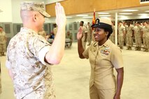 Richmond, Va.-native Mercedes N. Hargrove (right) recites the Oath of Enlistment led by Marine Col. Stephen E. Redifer, commanding officer of Chemical Biological Incident Response Force (CBIRF), during a promotion ceremony at Naval Support Facility Indian Head, Md., May 4, 2016. Hargrove serves as the Navy Senior Enlisted Leader with CBIRF. (Official USMC Photo by Sgt. Jonathan Herrera/Released)