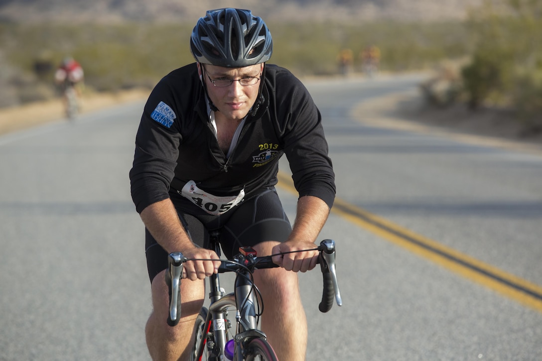 A cyclist completes a 50-mile ride during the Park-to-Park Bike Ride through Joshua Tree National Park, Calif., April 30, 2016. The event was hosted as a joint effort between the Combat Center, the City of Twentynine Palms and the Joshua Tree National Park Service to celebrate Earth Day as well as the 100-year anniversary of the park. (Official Marine Corps photo by Lance Cpl. Levi Schultz/Released)