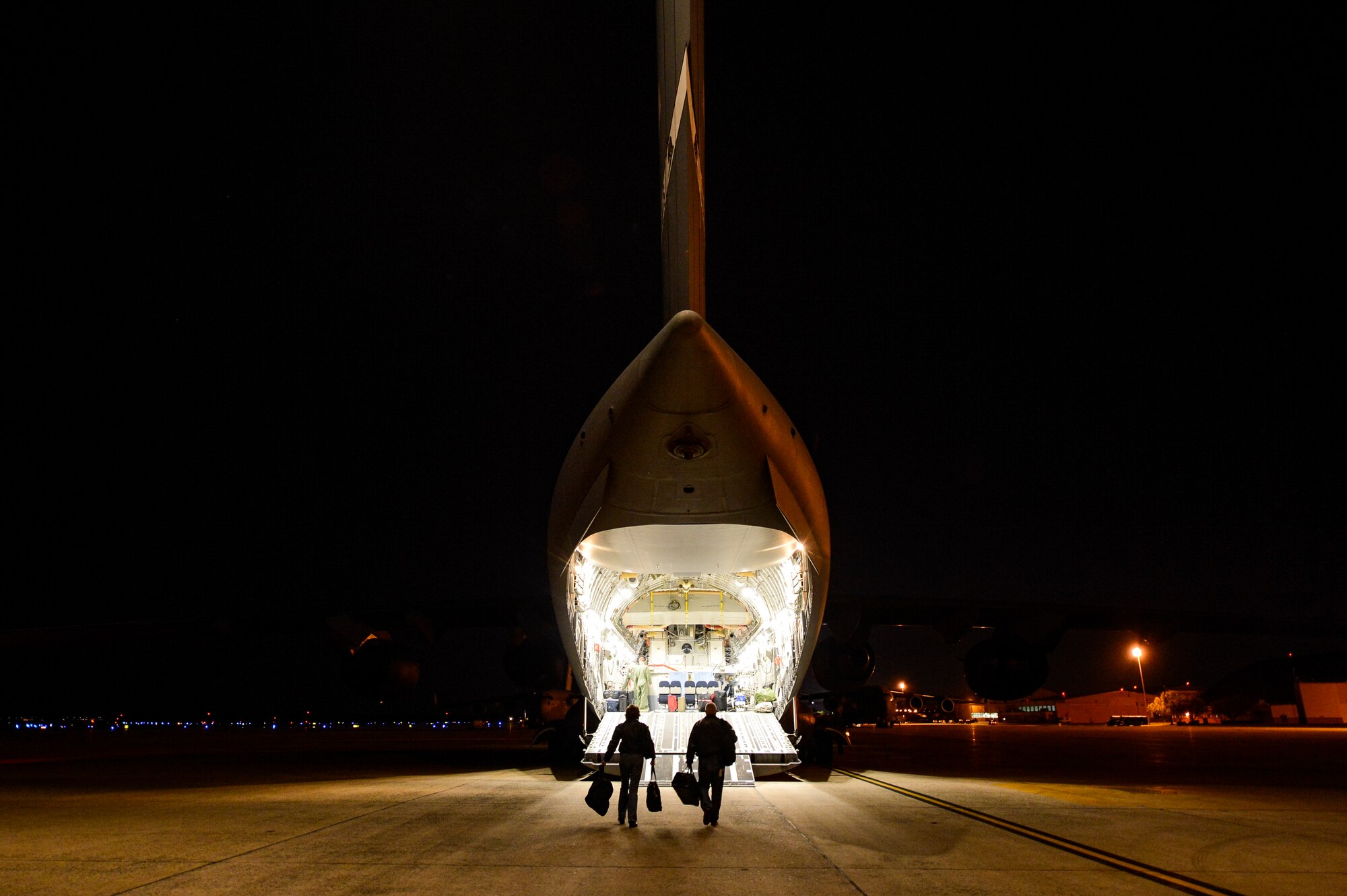 Vickie McCall, left, and Dr. Joe Leverett board a C-17 Globemaster III at Joint Base Andrews, Md., April 17, 2016, to start their weeklong civic leader trip to several bases in Europe. Air Force civic leaders are unpaid advisers, key communicators and advocates for the Air Force. (U.S. Air Force photo/Tech. Sgt. Joshua DeMotts)