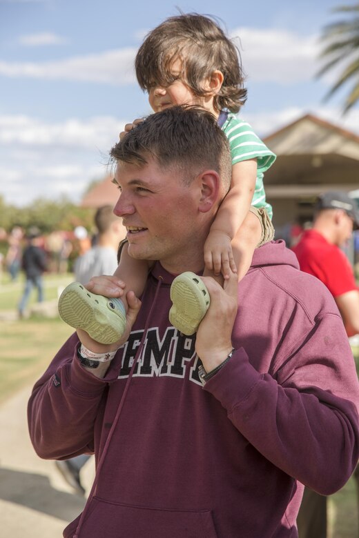 James Middleton, 7, attempts to hit a target with a ball to dunk his father, Lt. Col. Brian Middleton, battalion commander, 3rd Battalion, 4th Marines, 7th Marine Regiment, during the battalion’s Family Day at Desert Winds Golf Course April 29, 2016. (Official Marine Corps photo by Lance Cpl. Levi Schultz/Released)