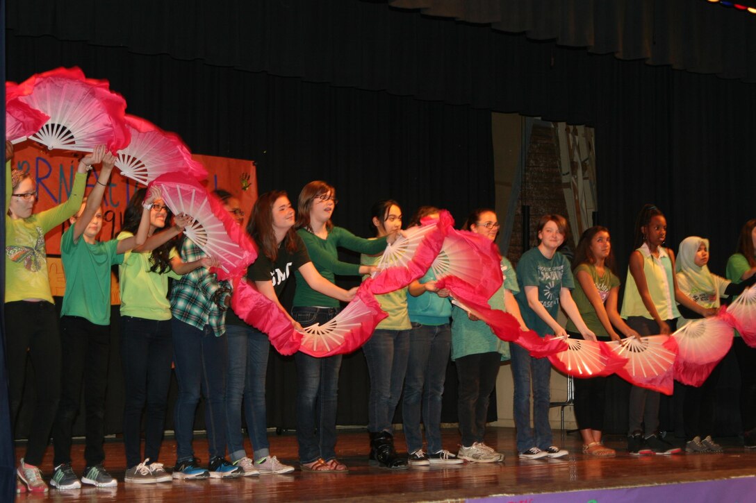 Students in Chinese class at Quantico Middle/High School perform a Chinese fan dance at the school’s International Night, Apr. 21.