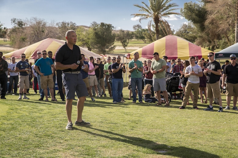 James Middleton, 7, attempts to hit a target with a ball to dunk his father, Lt. Col. Brian Middleton, battalion commander, 3rd Battalion, 4th Marines, 7th Marine Regiment, during the battalion’s Family Day at Desert Winds Golf Course April 29, 2016. (Official Marine Corps photo by Lance Cpl. Levi Schultz/Released)