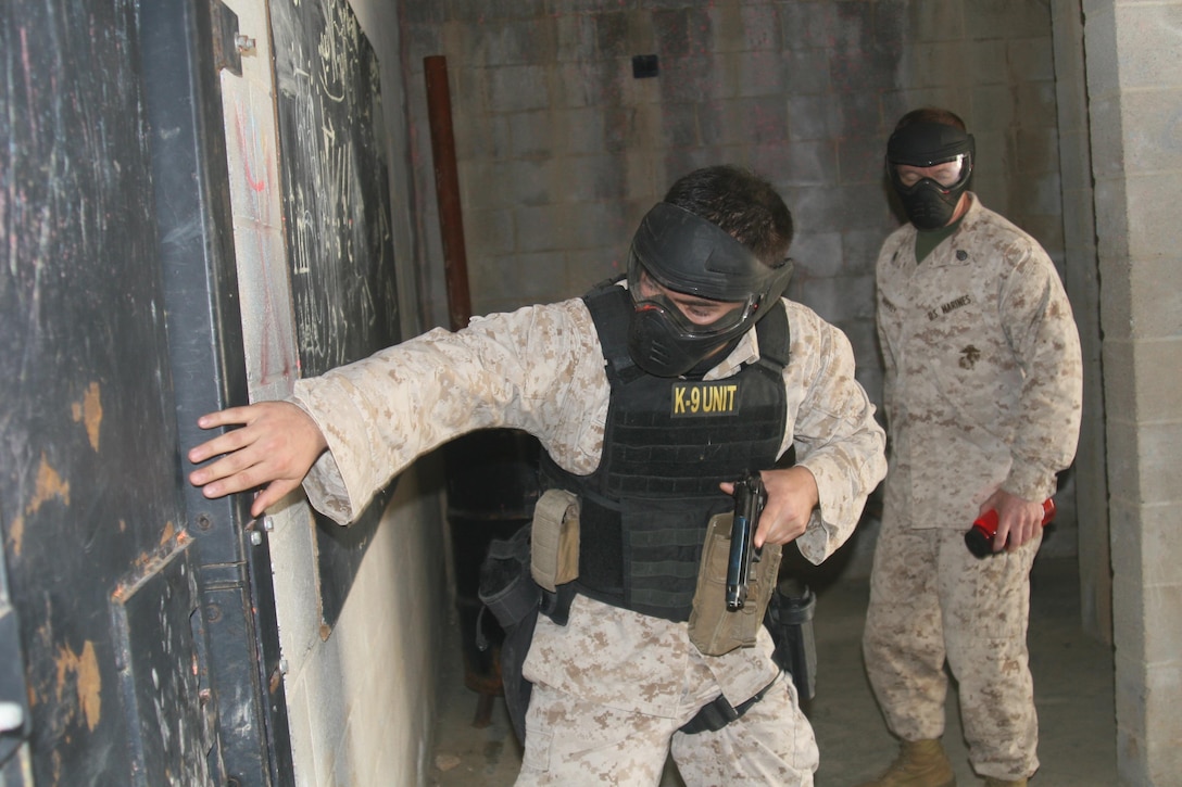 Sgt. Shawn Edens tests a door to see whether it is locked during active shooter training for Security Battalion April 19.