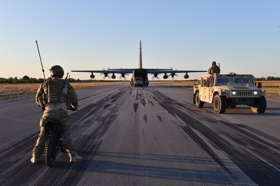 U.S. Air Force Airmen transport simulated patients to a MC-130J Commando II at Eglin Range, Fla., May, 4, 2016, during Exercise Emerald Warrior 16. Emerald Warrior is a U.S. Special Operation Command sponsored mission rehearsal exercise during which joint special operations forces train to respond to real and emerging worldwide threats. (U.S. Air Force photo by Senior Airman Logan Carlson)
