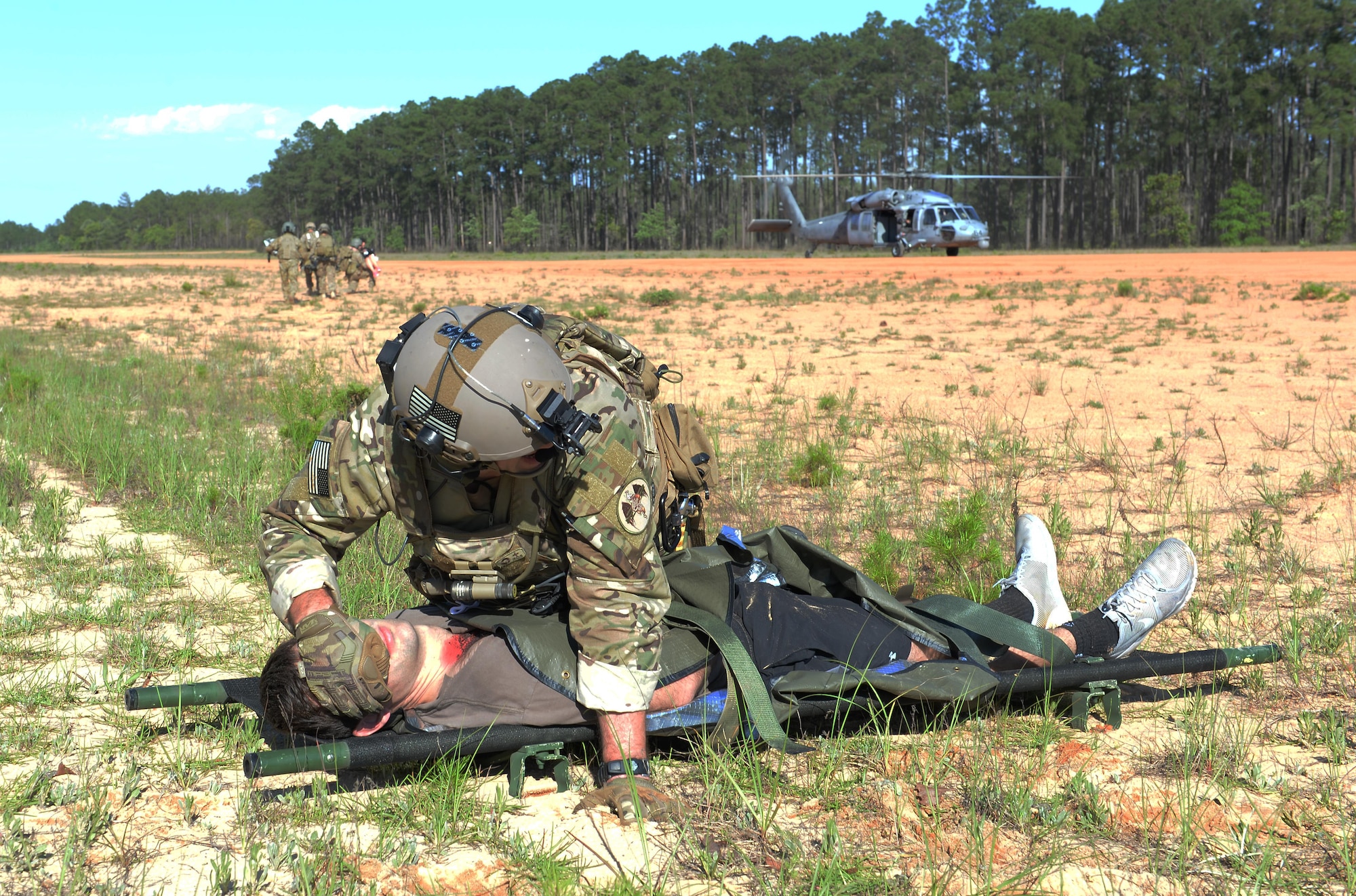 U.S. Air Force Staff Sgt. Dave Wieznicki, a combat medic assigned to the 27th Special Operations Support Squadron, Cannon Air Force Base, N.M., prepares to litter carry a patient to a U.S. Navy MH-60S Seahawk at Eglin Range, Fla., May 4, 2016, during Exercise Emerald Warrior 16. Emerald Warrior is a U.S. Special Operations Command sponsored mission rehearsal exercise during which joint special operations forces train to respond to real and emerging worldwide threats. (U.S. Air Force photo by Senior Airman Jasmonet Jackson)
