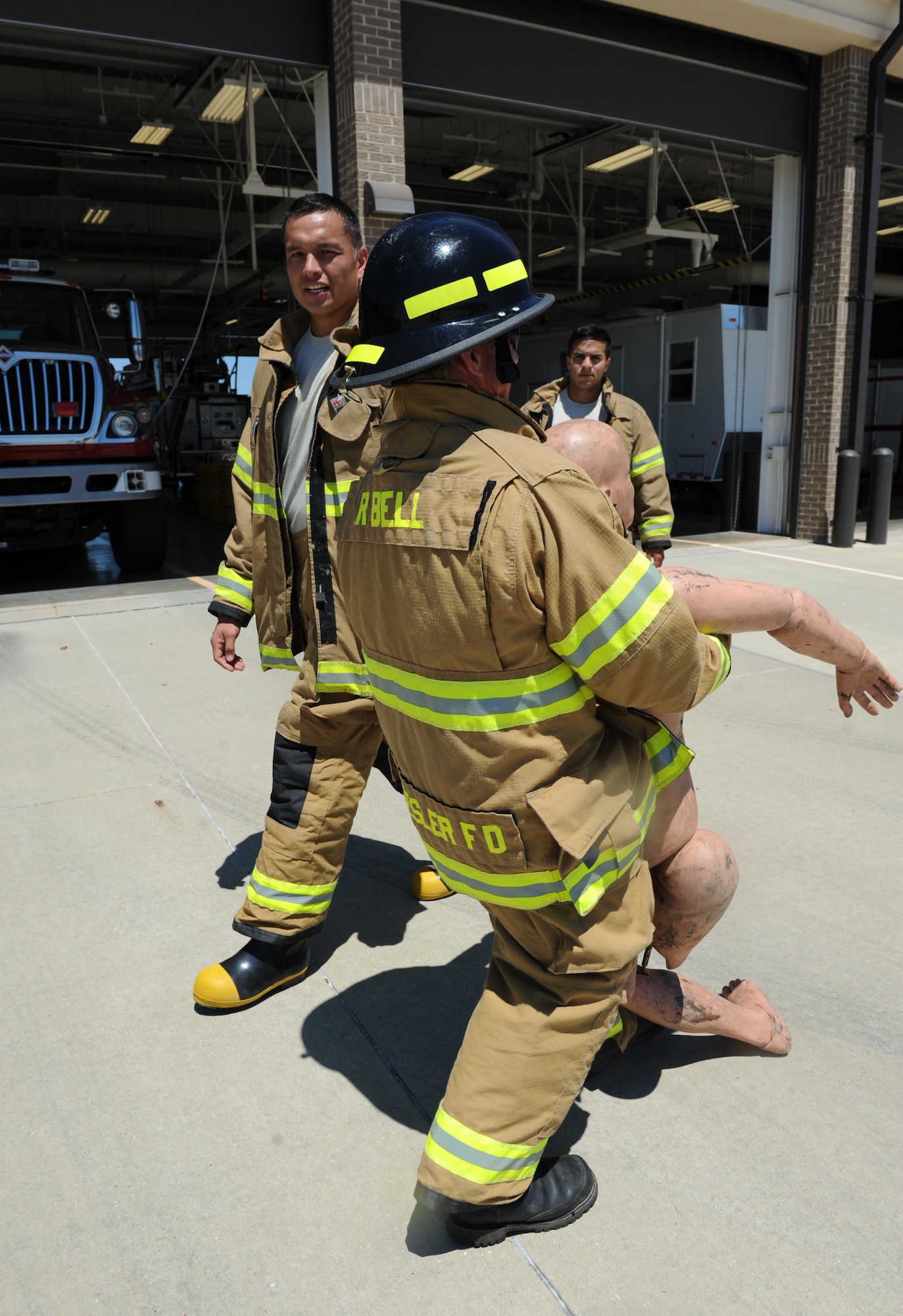 Rusty Bell, 81st Infrastructure Division firefighter, completes a 100-foot “dummy drag” while receiving encouragement by Tech. Sgt. Jeremy Noah, 81st ID station chief, at the Keesler Fire Department as he trains for the 2016 Firefighter Combat Challenge Competition Wild Card Week, May 4, 2016, Keesler Air Force Base, Miss. Four members from the fire department competed in the qualifying round at Lake Charles, La., Apr. 30. (U.S. Air Force photo by Kemberly Groue)