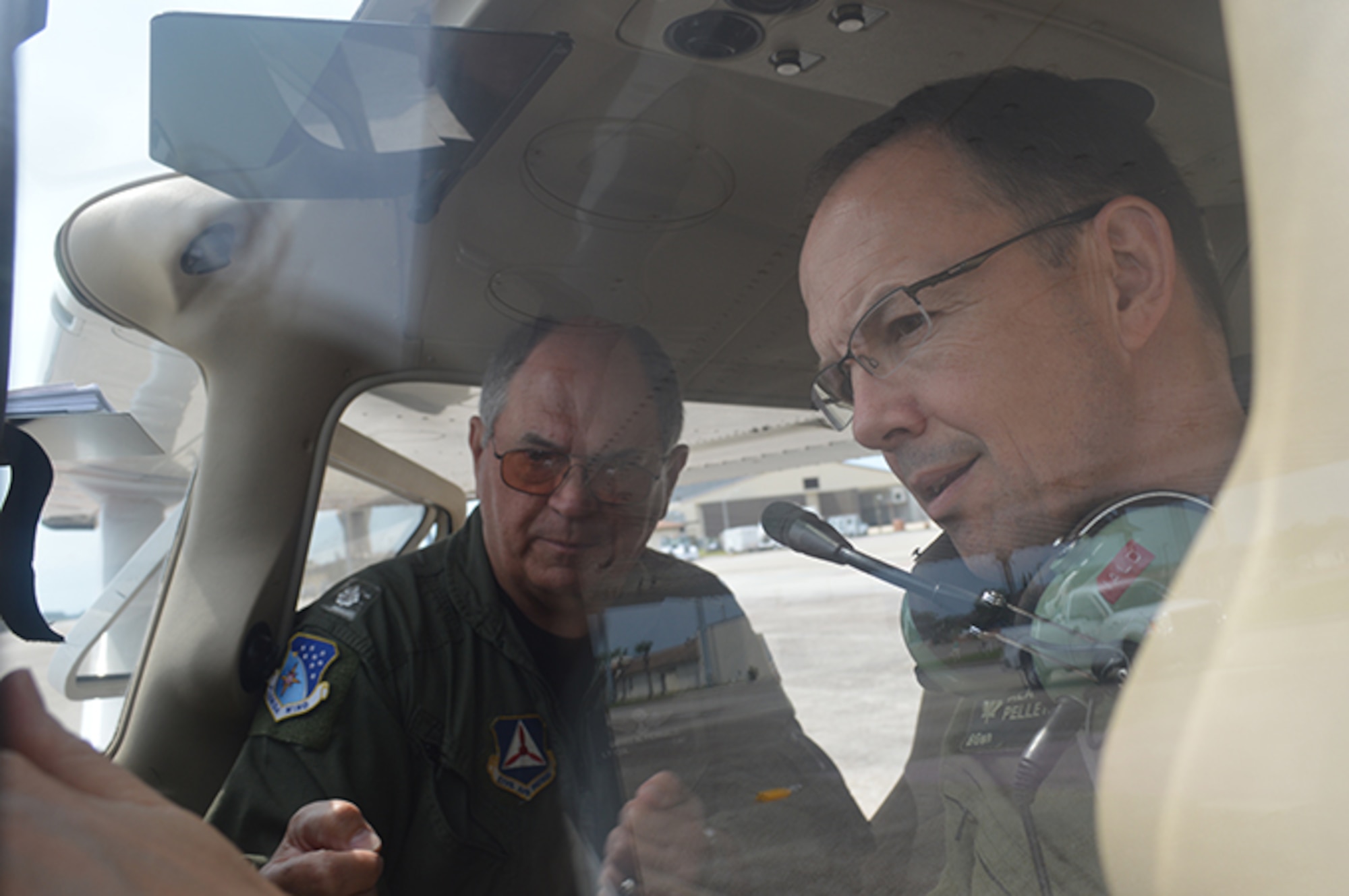 Florida Civil Air Patrol Wing Lt. Col. Larry Fernald, briefs BGen Alain Pelletier, Continental U.S. Aerospace Defense Region Deputy Commander, about the Cessna 127’s instrument panel prior to a CAP mission orientation flight May 2. Pelletier flew the mission with Fernald to familiarize himself about the CAP missions in the region that include fire watch in the Eglin Air Force Base, Fla., area and search and rescue upon request. (USAF Photo released by Mary McHale)