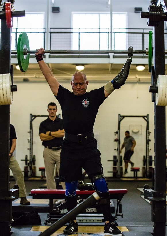 Army Sgt. 1st Class Ivan Morera conducts strength conditioning under the supervision of a Tactical Human Optimization, Rapid Rehabilitation and Reconditioning Program coach in the 7th Special Forces Group (Airborne)’s Combat Readiness Training Facility at Eglin Air Force Base, Fla., Feb. 10, 2016. In August 2013, Morera, a Special Forces medic, suffered severe damage to his left shoulder and knee, and had his left hand crushed when the vehicle he was driving rolled over while avoiding a suicide bomber in Afghanistan. Morera has since returned to full service. Army photo by Staff Sgt. Bryan Henson