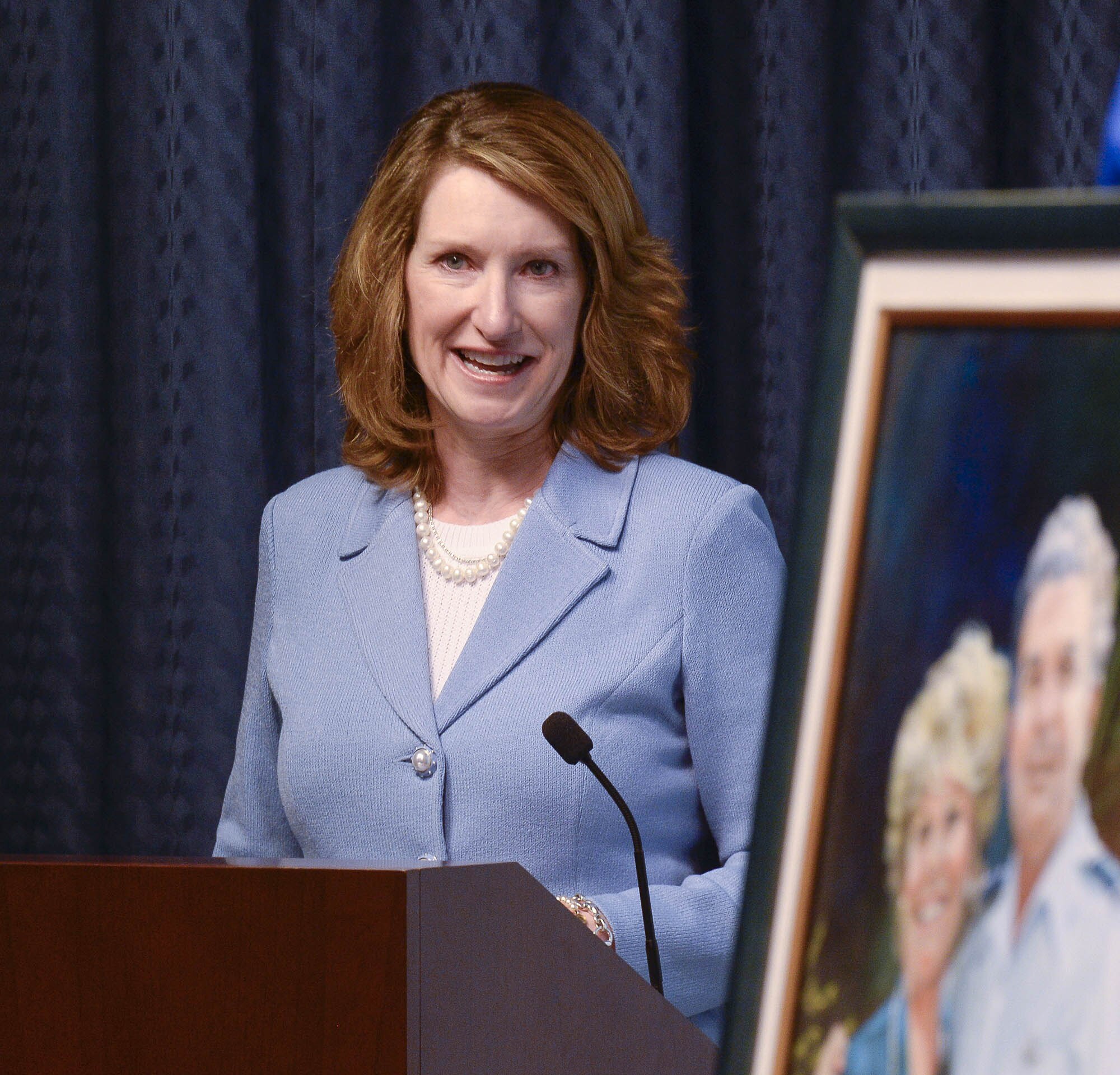Under Secretary of the Air Force Lisa Disbrow talks about the achievements of Col. William Liquori Jr. and his wife, Amy, before she presents them the 2015 General and Mrs. Jerome F. O'Malley Award during a ceremony in the Pentagon May 3, 2016.  The award was earned during the Liquoris’ time leading the 50th Space Wing at Schriever Air Force Base, Colo. (U.S. Air Force photo/Andy Morataya)